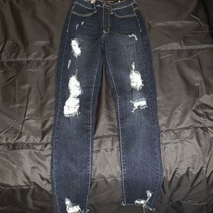 Dark blue distressed jeans